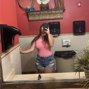 Pink bodysuit size M got it from factory connect no stains worn once